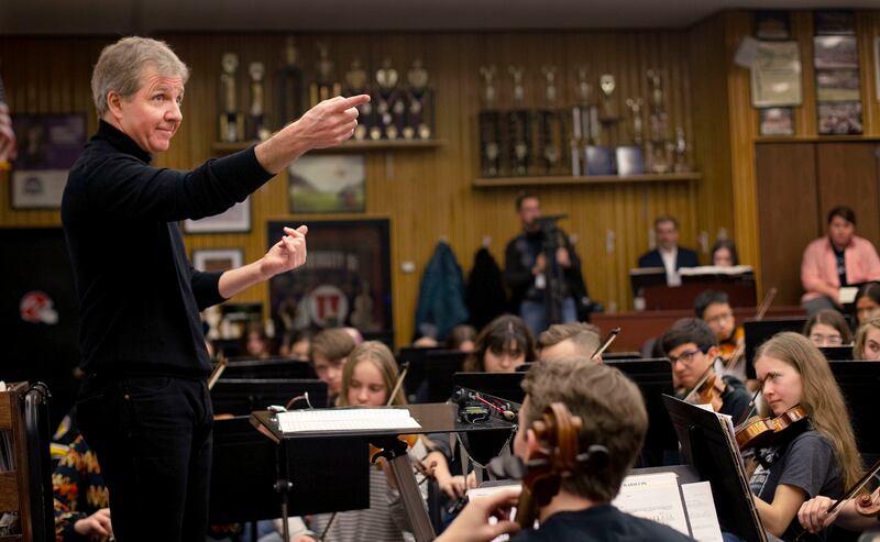 Thierry Fischer, music director of the Utah Symphony Orchestra, directs the Cottonwood High School orchestra in Murray on Thursday, March 14, 2019. High school orchestras across the state are rehearsing the same piece and will perform with the SuperOrche
