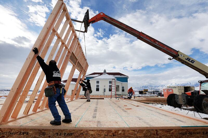 Crews from Dawson building systems put up a wall on a new home in Daybreak on Friday, Feb. 3, 2017.