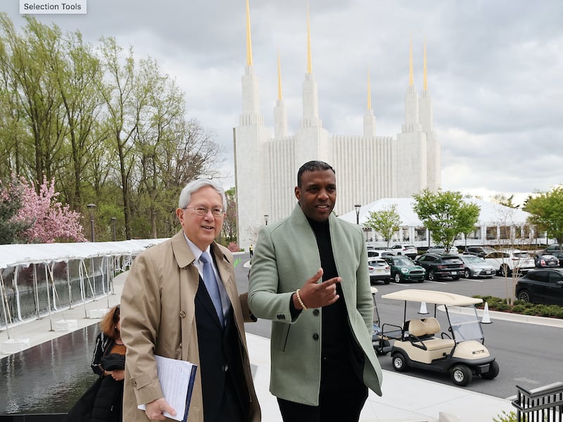 Elder Gerrit W. Gong, left, walks with Bachelor Johnson III at the Washington D.C. Temple in Kensington, Maryland in April 2022.