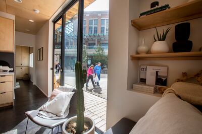 People walk past a Modal Living home at City Creek Center in Salt Lake City on Monday, May 20, 2019.