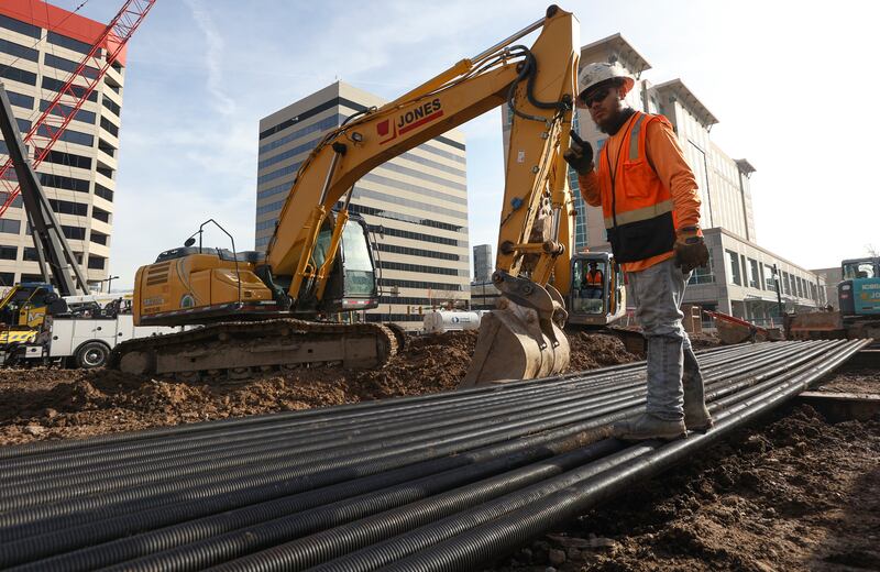 Jesus Perez, a Morris-Shea Bridge Co. Inc. laborer, works at the Astra Tower construction site, building a 40-story building that will offer 372 luxury residences, in downtown Salt Lake City on Wednesday, Jan. 12, 2022. He is contracted through Jacobsen Construction Company.