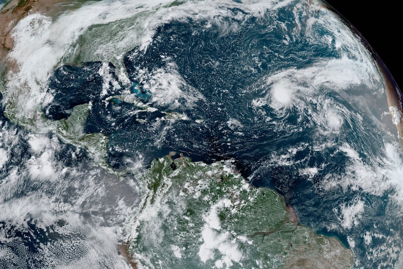 This GOES-16 GeoColor satellite image taken Thursday, Sept. 10, 2020, and provided by NOAA, shows tropical storms forming in the Atlantic.