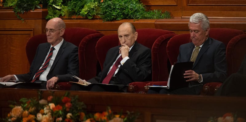 FILE - President Thomas S. Monson sits with his counselors President Henry B. Eyring First Counselor First Presidency and President Dieter F. Uchtdorf, Second Counselor in the First Presidency at the beginning of the Sunday morning session of the 186th Se