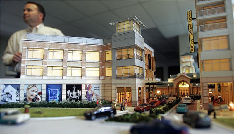 In July, Craig Tottier, vice president of development of CenterCal Properties, stands behind a 3-D model of what Station Park will look like when finished. Station Park will be a massive mixed-use development located along side the FrontRunner train stati