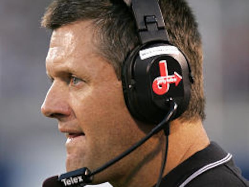 Utah defense coach Kyle Whittingham, shown at a U. game, says he hasn't made up his mind yet about BYU and U. offers.
