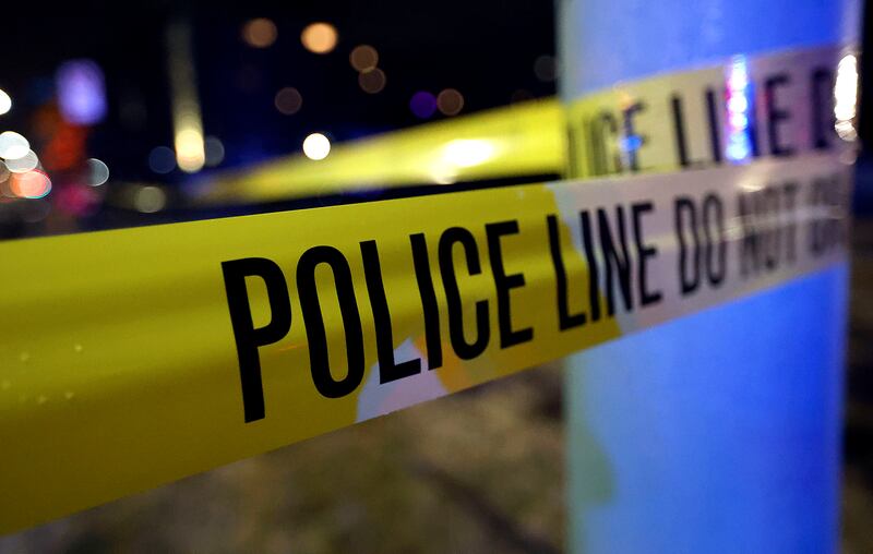 Police tape hangs at a scene in Salt Lake City on Monday, March 15, 2021.