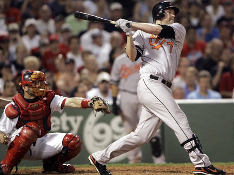 Baltimore Orioles' Aubrey Huff fhis a two-run single off of Red Sox pitcher Hideki Okajima on Tuesday.