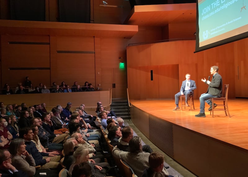 Dallas Jenkins, creator of “The Chosen,” right, speaks with moderator Patrick Mason during an event at Utah State University.