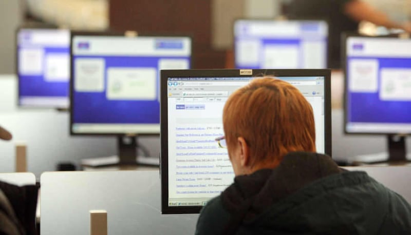 Computer users use the internet at the Millcreek Community Center Library in Salt Lake County Thursday, Jan. 3, 2013. Pew said about 85 percent of Americans 18 and older use the Internet, while 95 percent of Americans aged 12 to 17 are online.