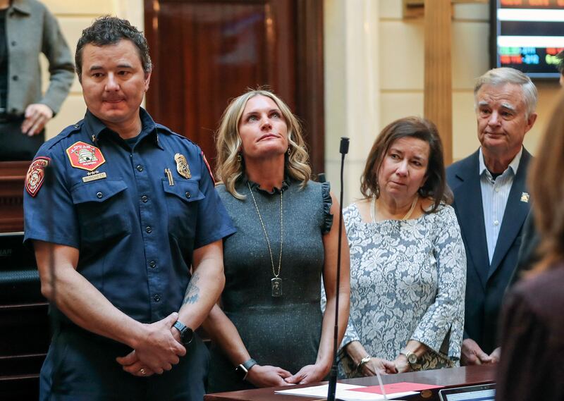 Family members of fallen Draper Battalion Chief Matthew Burchett — brother, Dominic Burchett, left, widow Heather Burchett, and parents Rose and Tom Burchett — are honored in the Senate chamber at the Capitol in Salt Lake City on Monday, Feb. 11, 2019. Ma