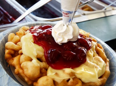 Kristin Atkins prepares a funnel cake at the Classic Bakery booth at the Utah State Fair in 2011.