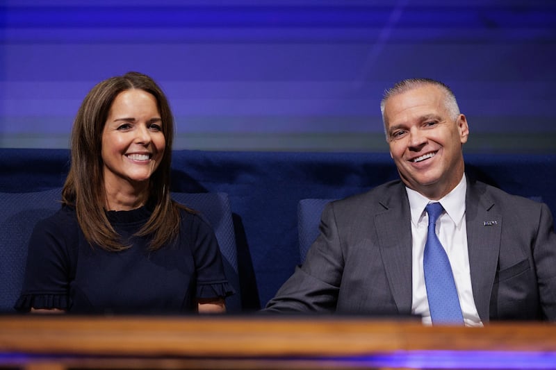 New BYU President Shane Reese and his wife Wendy Reese laugh together before speaking at a campus devotional on Sept. 12, 2023.