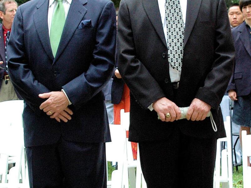 In this May, 2010, photo provided by Dean Shore, William Northrop, right, and Mike Mebane, Chairman of the Oak Ridge Military Academy Board of Trustees, attend a graduation ceremony at the academy in Oak Ridge, N.C. Northrop was hired to serve as commanda