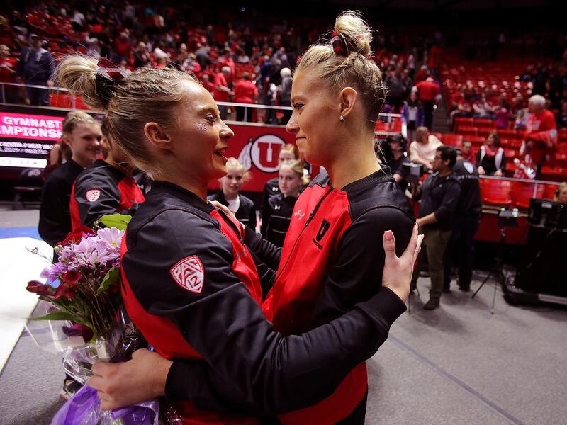 MyKayla Skinner and MaKenna Merrell-Giles hug after the meet as Utah and Michigan battle it out in Gymnastics at the Huntsman Center in Salt Lake City on Saturday, March 2, 2019.
