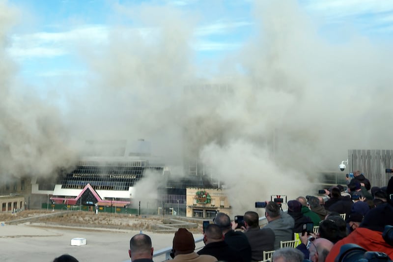 People watch the former Trump Plaza casino’s implosion in Atlantic City, New Jersey, on Wednesday, February 17, 2021.