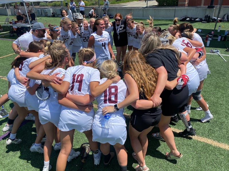 Lone Peak players huddle during semifinal victory over Bingham Tuesday, May 23.