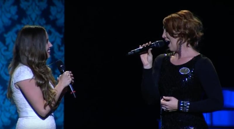 Nikki Bohne Lloyd, left, and Jessie Clark Funk, right, sing "For Good" from the Broadway musical "Wicked" during the preliminary stages of the Miss Utah Scholarship competition.