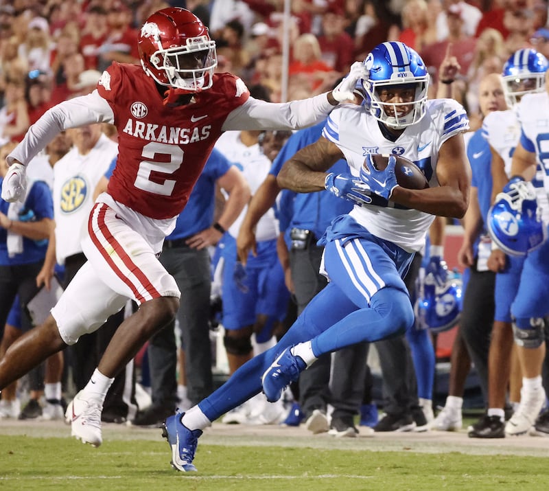 BYU receiver Keelan Marion runs for a big gain against Arkansas at Razorback Stadium in Fayetteville, Sept. 16, 2023.