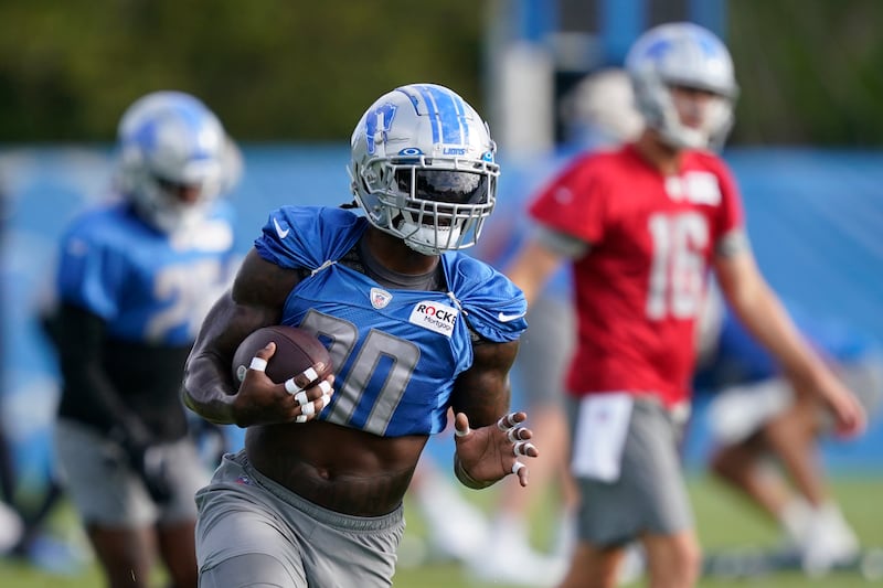 Detroit Lions running back Jamaal Williams participates in drills at the Lions NFL football practice facility, Monday, Aug. 15, 2022, in Allen Park, Mich. (AP Photo/Carlos Osorio)