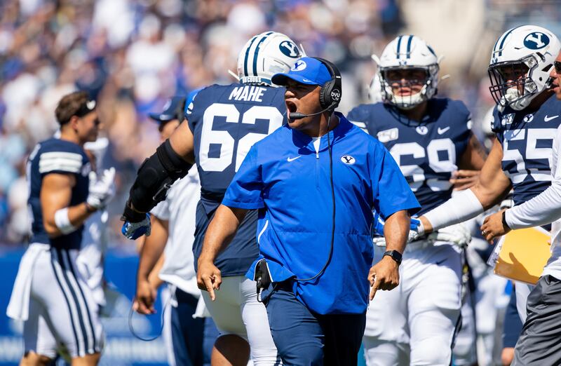 BYU defensive coordinator Ilaisa Tuiaki coaches from the sidelines during game against USC.