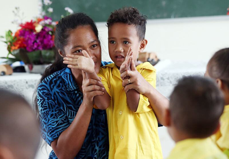 Teacher Sia Osa participates in an activity with her son Blesspolsi at Foundational Learning preschool at the Siumu Ward in Siumu, Samoa, on Thursday, May 16, 2019.