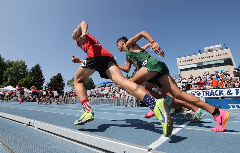 Runners run on the track