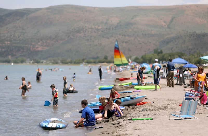 People recreate at Rendezvous Beach on the south shore of Bear Lake.