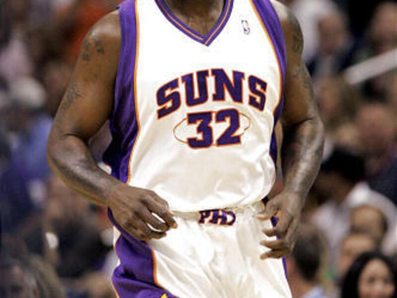 In this April 3, 2009 photo, Phoenix Suns center Shaquille O'Neal runs up the court against the Sacramento Kings during the first quarter of an NBA basketball game in Phoenix. The Cleveland Cavaliers are close to acquiring O'Neal in a trade that would pai