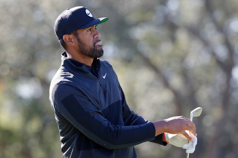 Tony Finau reacts as he watches his tee shot on the ninth hole during the third round of the Houston Open golf tournament, Saturday, Nov. 12, 2022, in Houston. (AP Photo/Michael Wyke)