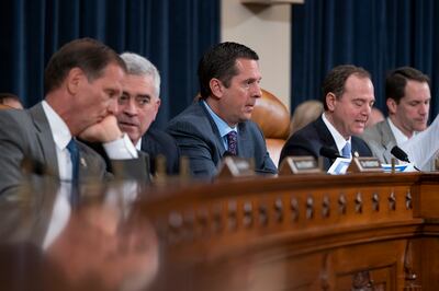 Rep. Devin Nunes, R-Calif., ranking member of the House Intelligence Committee, center, is joined by, from left, Rep. Chris Stewart, R-Utah, Rep. Brad Wenstrup, R-Ohio, Chairman Adam Schiff, D-Calif., and Rep. Jim Himes, D-Conn., during a hearing on polit