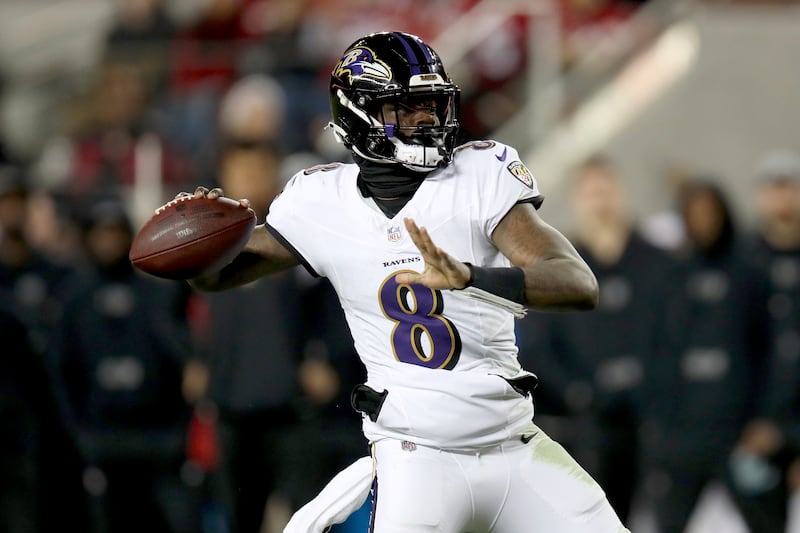 Baltimore Ravens quarterback Lamar Jackson (8) throws during a game against the San Francisco 49ers on Dec. 25, 2023.