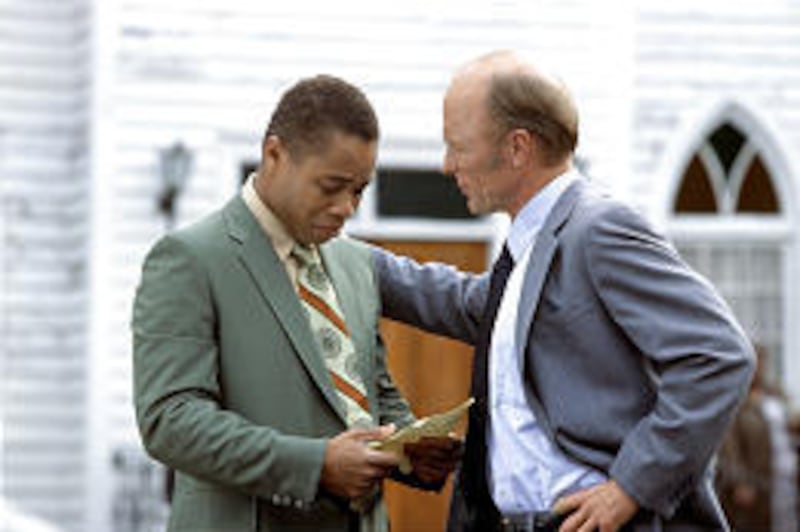 Radio, played by Cuba Gooding Jr., is befriended by a football coach, Ed Harris.