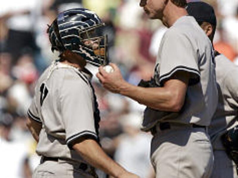 Yankees catcher John Flaherty talks to Randy Johnson after he gave up back-to-back-to-back homers.