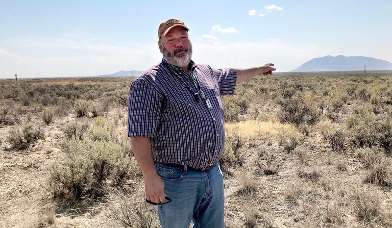 Don Miley, with the Idaho National Laboratory, gestures to a swath of land that may some day be home to the nation's first modular nuclear reactors. The NuScale Project is being pursued by the Utah Association of Municipal Providers to someday provide bas