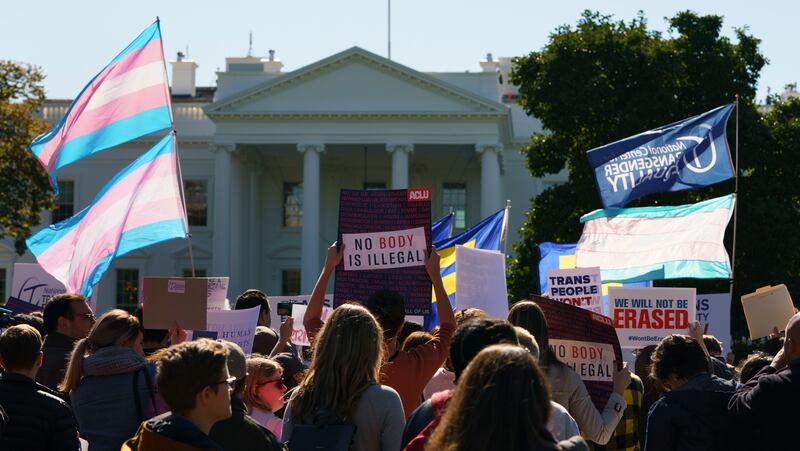 The National Center for Transgender Equality and the Human Rights Campaign gather on Pennsylvania Avenue in front of the White House in Washington, Monday, Oct. 22, 2018, for a #WontBeErased rally. (AP Photo/Carolyn Kaster)