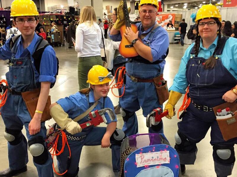 The Benedict family poses, dressed as "The Engineer," a character from the video game, "Team Fortress 2."