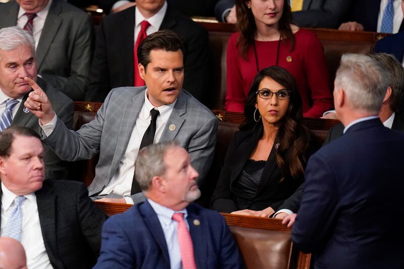 Rep. Matt Gaetz, R-Fla., talks to Rep. Kevin McCarthy, R-Calif., right, after Gaetz voted “present” in the House chamber as the House meets for the fourth day to elect a speaker and convene the 118th Congress in Washington, Friday, Jan. 6, 2023. 