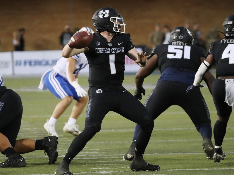 Utah State Aggies quarterback Logan Bonner throws in Logan.