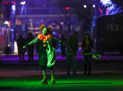 Taylor Morgan roller skates in her costume as she works at Fear Factory in Salt Lake City on Tuesday, Oct. 16, 2018.