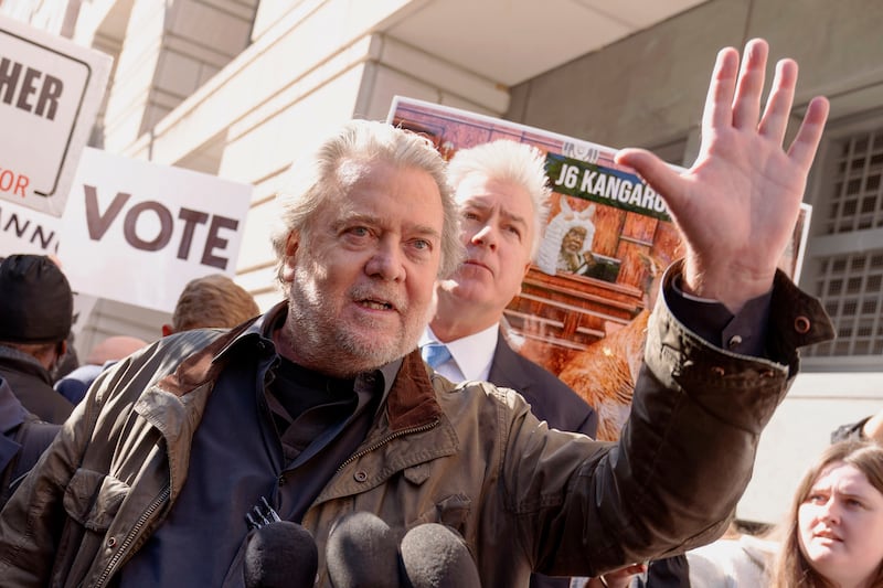 Steve Bannon, center, and his attorney Evan Corcoran, right, speak to the media as he leaves the federal courthouse.
