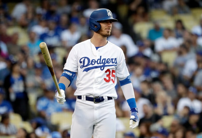 FILE - Los Angeles Dodgers' Cody Bellinger steps off the batter's box during the first inning of a baseball game against the San Diego Padres, Friday, July 5, 2019, in Los Angeles.