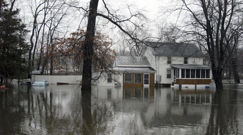 A home is flooded in Washingtonville, N.Y., early Monday, March 7, 2011. Flooding has closed several roads in Ulster County and other areas south of Albany. Parts of upstate New York are buried under more than 2 feet of heavy snow, with freezing rain, sle