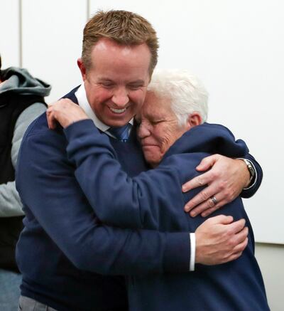 Chris Kotrodimos an investigator with the Salt Lake County District Attorney's Office, smiles as he hugs Judi Collins, mother of Levi Joseph Collins, who has been missing since 2014, following a press conference at the district attorney's office in Salt L