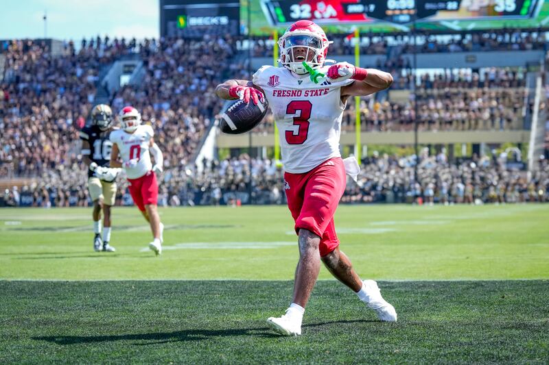 Fresno State wide receiver Erik Brooks celebrates scoring a touchdown