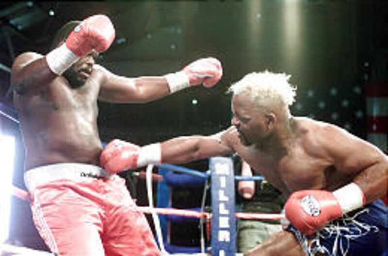 Bradley Rone, left, takes a punch from Willie Chapman of Ogden during a 2001 fight in Wendover.