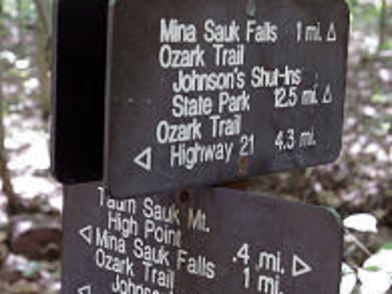 A marker indicates several directions, including one of the starting points of the Ozark Trail and Taum Sauk Mountain State Park entrance. The Ozark Trail winds through 13 counties.