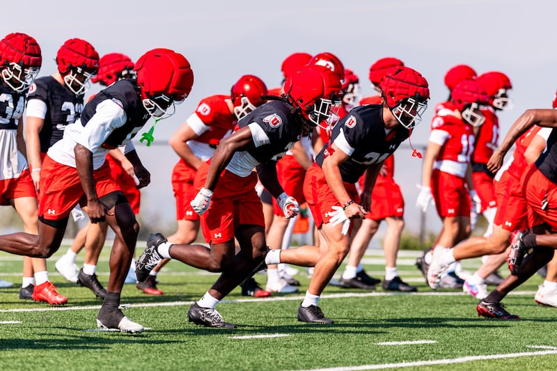 Utah football players run through drills during first practice of fall camp at Spence and Cleone Eccles Football Facility in Salt Lake City, on Monday, Aug. 3, 2026.