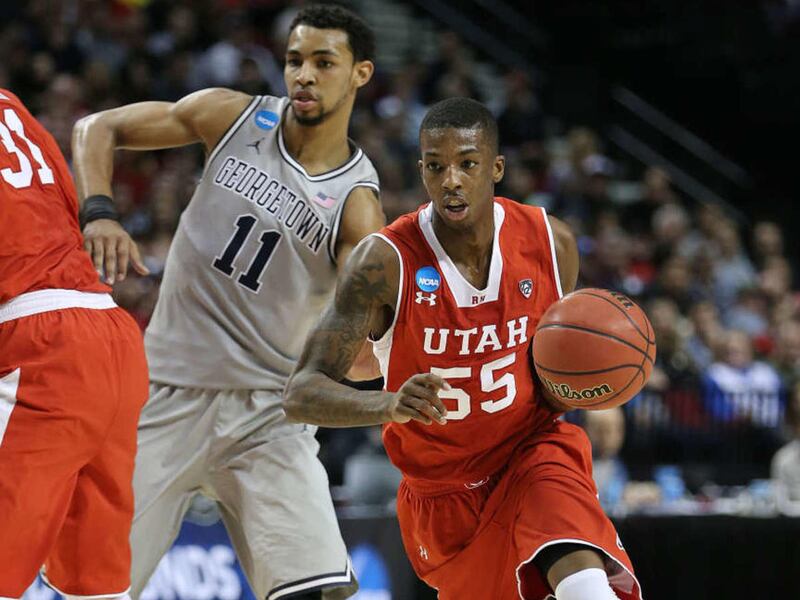 Utah Utes guard Delon Wright (55) gets past Georgetown Hoyas forward Isaac Copeland (11) as Utah and Georgetown play Saturday, March 21, 2015, in the 3rd round of the NCAA tournament in Portland Oregon at the Moda Center.