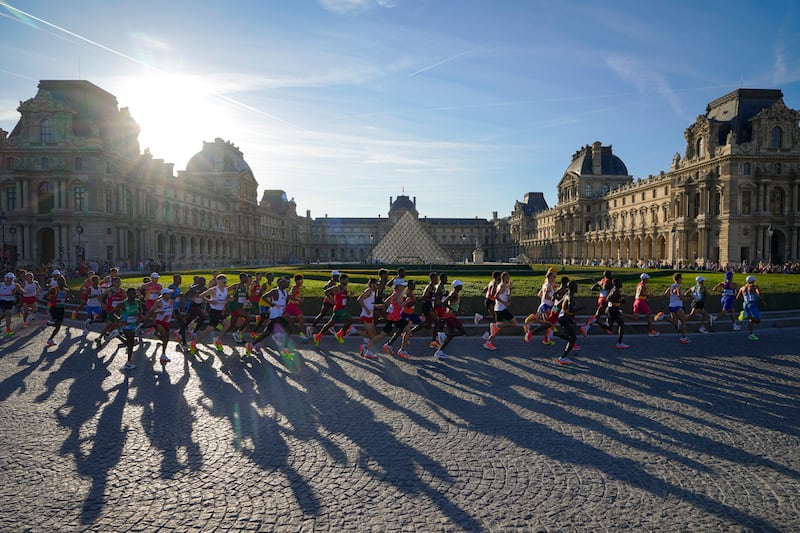 Athletes compete during the men's marathon competition at the 2024 Summer Olympics, Saturday, Aug. 10, 2024, in Paris, France.