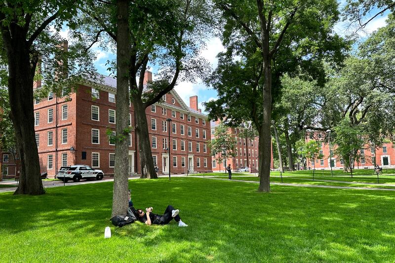 A person relaxes at Harvard University on June 29, 2023. The Supreme Court on Thursday struck down affirmative action in college admissions.